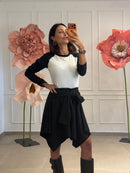 Gonna a punte assimetrica tinta unita