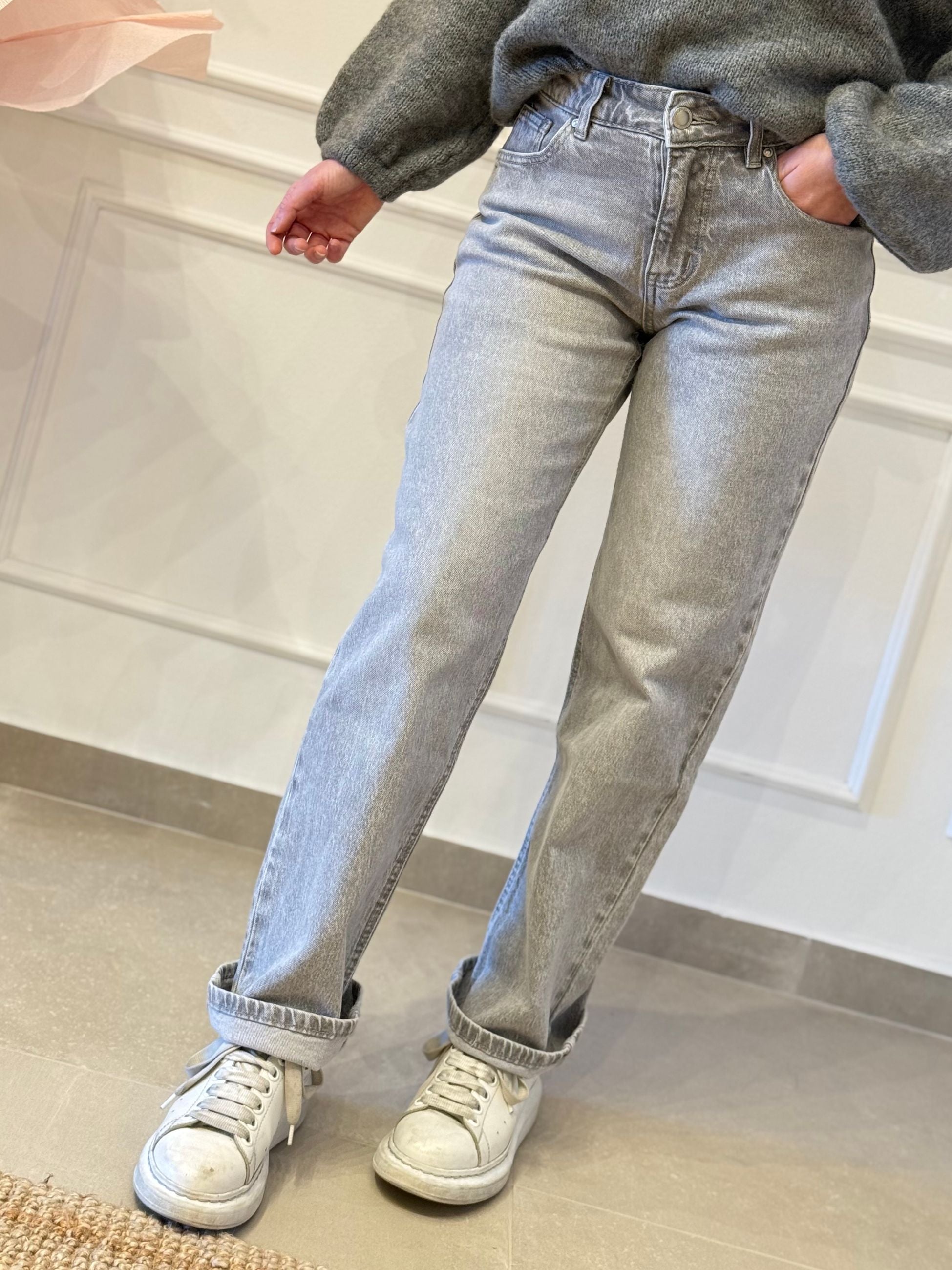 Jeans tasca con fiocco